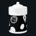Vibrant synthetic design<br><div class="desc">This teapot exhibits curved organic white lines and spots that play around it floating on a flat black background.</div>