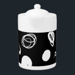 Vibrant synthetic design<br><div class="desc">This teapot exhibits curved organic white lines and spots that play around it floating on a flat black background.</div>