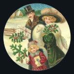 Victorian family in the snow Christmas scene Classic Round Sticker<br><div class="desc">Vintage illustration of a Victorian family with Christmas gifts and present,  walking in a winter wonderland covered with snow.</div>