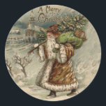 Victorian Santa Claus Christmas Tree Classic Round Sticker<br><div class="desc">Vintage Santa Claus Carrying a Crhistmas Tree Since when does Santa actually bring a tree with him? This image is based on a vintage Christmas Card from the late 1800s. Back then, Santa didn't always wear red. In this Santa Claus illustration, St. Nick is wearing a warm brown suit, and...</div>