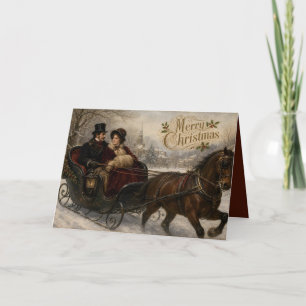 Victorian sleigh ride through snowy village holiday card