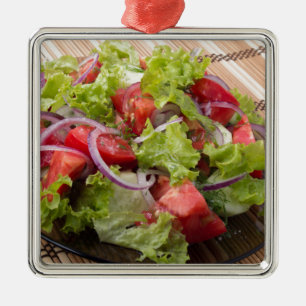 View angle on a fragment of vegetarian salad metal tree decoration