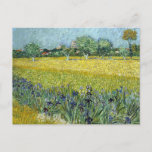 View At Arles With Irises by Vincent Van Gogh Postcard<br><div class="desc">This postcard is of the painting View At Arles With Irises by Vincent Van Gogh. It is an oil painting on canvas. Just two weeks after starting to draw again, his notes dated May 12, 1888 stated " "This view [... ] surrounded by fields all covered with yellow and purple...</div>