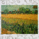 View of Arles with Irises by Vincent van Gogh Jigsaw Puzzle<br><div class="desc">View of Arles with Irises in the Foreground by Vincent van Gogh is a vintage fine art post impressionism landscape nature painting. A wheat field with purple iris flowers in the foreground on a farm. Trees and the town of Arles with houses are in the background. About the artist: Vincent...</div>