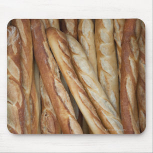view of bread loaves in bakery window display mouse mat