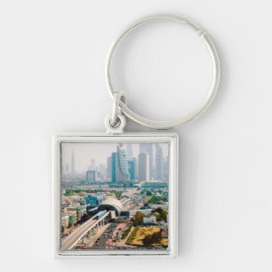 View of city metro line and skyscrapers key ring
