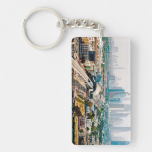 View of city metro line and skyscrapers key ring