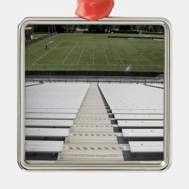 View of football field from empty bleachers metal tree decoration (Front)