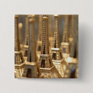 view of small eiffel towers for sale to tourists 15 cm square badge