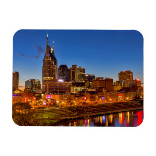 View of the city skyline at dusk magnet