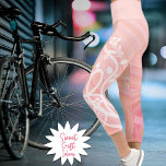 Vines and Flowers Over Peach and Pink Spirals Capri Leggings<br><div class="desc">These pastel leggings feature my white vine and floral design along the left leg over shades of pastel pink,  raspberry and peach spirals with matching raspberry waistband.</div>