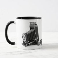 vintage bellows camera with roll of film