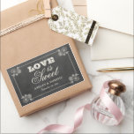 Vintage Black Chalkboard Wedding Love is Sweet Rectangular Sticker<br><div class="desc">Whimsical wedding favour stickers in a rectangular shape feature "Love is Sweet" with a monogram of the bride and groom names and wedding date and floral frame design with a soft white chalk appearance on a rustic black board background with textured look.</div>