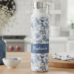 Vintage Blue Floral Toile Monogram Water Bottle<br><div class="desc">Elevate your style with this gorgeous blue toile floral insulated water bottle, personalized just for you! Featuring a timeless blue and white toile-style botanical pattern that evokes classic elegance, this design is as beautiful as it is functional. The rich blue panel is customized with a graceful script, making it a...</div>