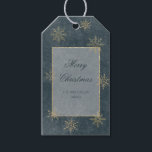 Vintage Blue & Gold Glitter Snowflakes Gift Tags<br><div class="desc">Against a backdrop of deep, mesmerising dark blue, reminiscent of the infinite expanse of the universe, this gift tag sets the stage for a truly magical look. The night sky is beautifully distressed with delicate white etchings, like ethereal constellations, while golden glittering snowflakes sprinkle across the canvas, adding a touch...</div>