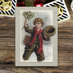 Vintage Boy in Snow with Merry Christmas Greeting Holiday Card<br><div class="desc">Cheery curly-haired vintage schoolboy walking through the snow tipping his hat and waving a bough of mistletoe with Merry Christmas greeting.</div>