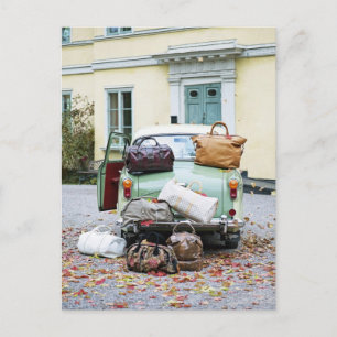 Vintage car with lots of luggage postcard