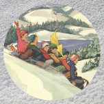 Vintage Christmas, Children Sledding on a Mountain Classic Round Sticker<br><div class="desc">Vintage illustration Merry Christmas holiday snowscape design featuring children,  a group of boys and girls having fun sledding down a snow covered hill. Mountains,  trees and a lake complete this beautiful winter landscape. Reminds me of winters in Donner in Lake Tahoe.</div>