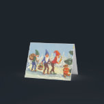 Vintage Christmas, Elves in the Snow Forest Winter Holiday Card<br><div class="desc">Vintage illustration Victorian Merry Christmas holiday image featuring elves with beards and pointed hats walking in the snow. They look like tomte, nisse or tomtenisse (Sweden) nisse (Norway and Denmark) or tonttu (Finland), a mythological creature from Scandinavian Norse folklore. The blue elf is carrying a wreath, the green elf is...</div>