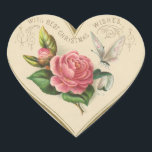 Vintage Christmas Rose and Butterfly Heart Sticker<br><div class="desc">This vintage sticker features a heart with a Christmas rose,  butterfly and greetings. This lovely sticker can be used on cards,  envelopes,  gift baskets,  presents etc.

Enjoy your new Vintage Christmas Rose and Butterfly Heart Sticker!</div>
