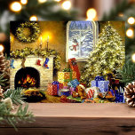 Vintage Christmas Tree Livingroom Scene Holiday Card<br><div class="desc">Vintage Christmas Tree Livingroom Scene Holiday Card. This design features a beautiful fireplace mantle decorated with lit garland, stockings, and candles. There is a snowman peeking through the window and a hoard of presents sitting beneath the decorated lit Christmas tree. What a beautiful vintage retro holiday scene. Personalize this custom...</div>
