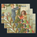 Vintage Christmas, Victorian Children Decorating Wrapping Paper Sheet<br><div class="desc">Vintage illustration Victorian Merry Christmas holiday image featuring children decorating the house with holly wreaths and garlands. Brother and sisters working together! The boy is standing on a ladder while the girls are helping him. A cute teddy bear is sitting on an old fashioned rocking horse.</div>