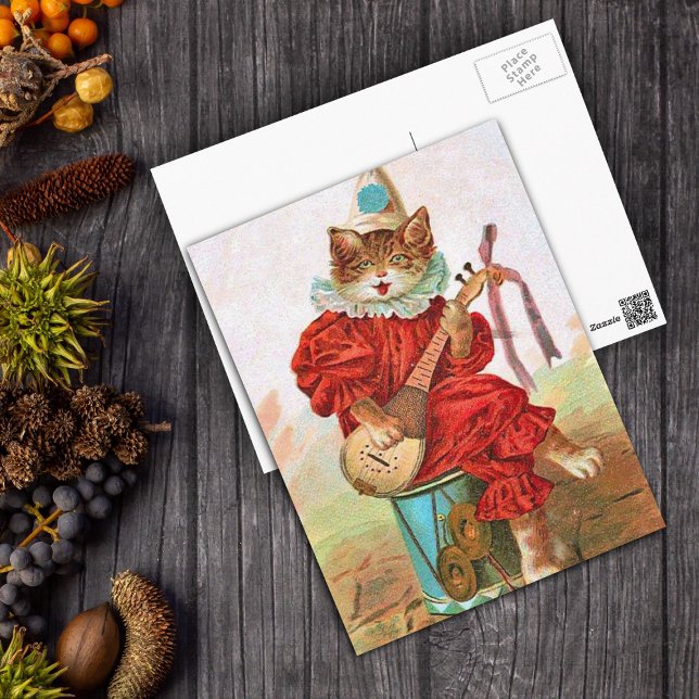 Vintage Clown Jester Musician Cat Mandolin Postcard (Jester cat in red out fit sitting on drum playing a mandolin on a postcard.)