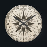 Vintage Compass Rose Wall Clock<br><div class="desc">A vintage compass rose in sepia on a parchment toned antiqued background. Centre reads "mariner's compass." Count time as the hands move across the compass directions. North is at 12:00. Fantastic gift for a travel agent,  ship captain or world traveller.</div>