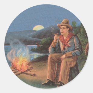 Vintage cowboy with camp fire and moon classic round sticker