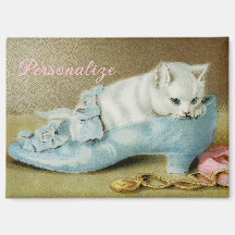 Vintage cute white kitten in a blue satin shoe