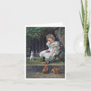 Vintage Easter card girl feeding bunnies