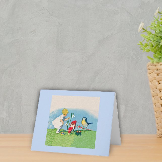 Vintage Elves Bird Easter Eggs Holiday Card (Little girl with singing bird and cute elves in red hats in grass with flowers light blue notecards.)