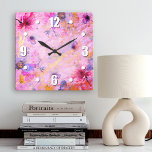 Vintage gold pink floral watercolor romantic chic square wall clock<br><div class="desc">Bold, white easy-to-read numerals, along with pink, purple, and blue watercolor flowers, overlay gold script on a gorgeous, pink, purple, and gold veined background. Enliven up your favourite room with this chic, stunning, stylish wall clock. Your choice of a round or square clock face. Makes a wonderful, elegant statement in...</div>