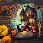 Vintage Halloween Witch and Black Cat Holiday Card<br><div class="desc">A beautiful vintage style witch with her black cat Halloween haunted house and pumpkins fall scene holiday Card. Perfect for Halloween enthusiasts and or sending out to friends and family. Personalise this and add your own message on the back.</div>