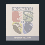 Vintage HOGWARTS™ Stamped Crest Notepad<br><div class="desc">Show your house pride in bold, vintage-inspired style with this striking Hogwarts™ crest design. Featuring graphic silhouettes representing the four iconic houses — Gryffindor™, Slytherin™, Hufflepuff™, and Ravenclaw™ — this artwork blends classic symbolism with a modern, retro aesthetic. Each house emblem is set within a clean, color-blocked shield, creating a...</div>