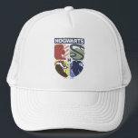Vintage HOGWARTS™ Stamped Crest Trucker Hat<br><div class="desc">Show your house pride in bold, vintage-inspired style with this striking Hogwarts™ crest design. Featuring graphic silhouettes representing the four iconic houses — Gryffindor™, Slytherin™, Hufflepuff™, and Ravenclaw™ — this artwork blends classic symbolism with a modern, retro aesthetic. Each house emblem is set within a clean, color-blocked shield, creating a...</div>