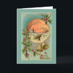 Vintage Holly, Christmas Bells and Snow Scene Holiday Card<br><div class="desc">Colourful Victorian Christmas greeting card illustration featuring brass bells,  A Merry Christmas greeting in ornate typography,  starry sky and round inset with vignette of a man carrying a Christmas tree in the snow with trees and village at sunset. Background colour is customisable. Back features complementary graphics and text fields.</div>