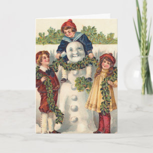 Vintage kids building snowman holiday card