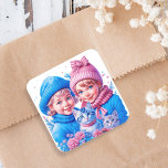 Vintage Kids with Blue and Pink Kittens Christmas Square Sticker<br><div class="desc">Adorable little vintage girl and boy in pink and blue holding kittens with a floral and snowy background. Add a sweet retro or nostalgic vibe to your Christmas cards or party treat bags!</div>