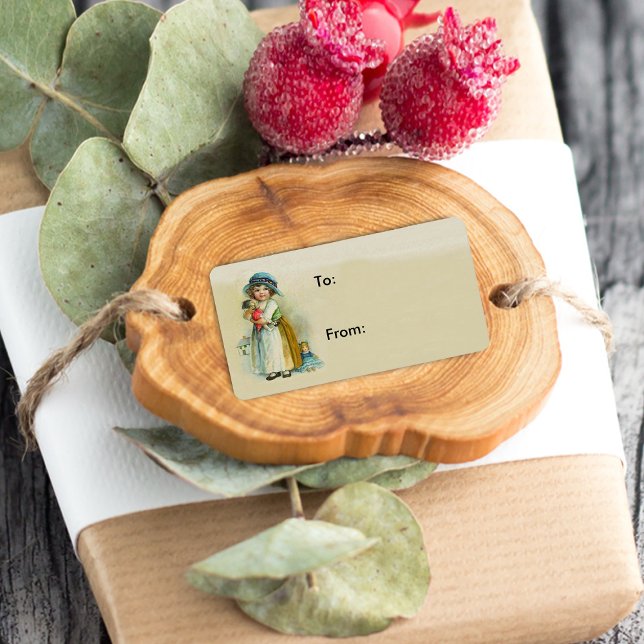 Vintage Little Girl Chubby Cheeks Hat Dolls Label (Victorian girl holding dolls on tan and cream coloured gift tag labels.)