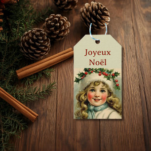 Vintage little girl  with  mistletoe gift tags