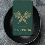 Vintage Minimalist Green And Gold Tattoo Artist Business Card<br><div class="desc">Elevate your brand with our Vintage Minimalist Green and Gold Tattoo Artist Business Card, designed for the discerning tattoo professional. This sleek, vertical card seamlessly blends bold aesthetics with a minimalist approach, creating a powerful statement of your artistry and professionalism. The deep green backdrop exudes sophistication, while the elegant gold...</div>