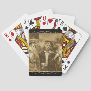 Vintage photograph of newsies smoking cigars playing cards