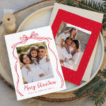Vintage Red Bow Merry Christmas 2 Photo Holiday Card<br><div class="desc">Celebrate the holiday season with this charming Christmas card featuring your family's photo framed by a festive red bow and ribbon on a crisp white background. "Merry Christmas" is elegantly written in a charming red handwritten script, with space to personalise your family name below. The back of the card showcases...</div>