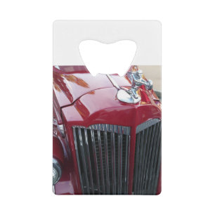 vintage red car with chrome hood ornament
