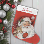 Vintage Retro Santa And Reindeer Personalised Large Christmas Stocking<br><div class="desc">This Vintage Retro Santa and Reindeer Personalised Christmas Stocking is the perfect blend of nostalgia and charm, bringing a touch of classic holiday spirit to your festive decor. This stocking features a delightful, old-fashioned illustration of Santa Claus and his trusty reindeer, reminiscent of cherished childhood memories. The vibrant colours and...</div>