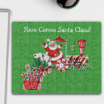 Vintage Santa Riding Train Candy Wheels Letters  Jigsaw Puzzle<br><div class="desc">This acrylic jig saw puzzle has a a vintage Santa Claus riding a train made of peppermint candy carrying letters and candy canes with Noel printed on engine on a dark green background with faux gold sparkles.  Customise the Here Comes Santa Claus with the template.</div>