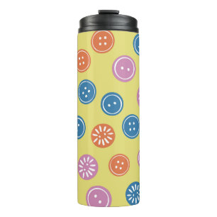Vintage seamless pattern with buttons on a yellow thermal tumbler