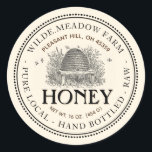 Vintage Skep Pure Local Hand Bottled Raw Honey Classic Round Sticker<br><div class="desc">A nice old-fashioned-looking label with a dainty double border of dots and a delicate line surrounds this pale ivory Honey Jar Label with Vintage Skep Illustration. It has a double curved text border with room for Apiary Name and Location at top of label, and honey description at bottom. The word...</div>