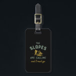 Vintage Skiing Quote Slopes Are Calling I Must Go Luggage Tag<br><div class="desc">The Slopes Are Calling and I Must Go. Funny winter sports design for skier. Cool vintage and retro merchandise to wear as you ride your skis down the snow-covered slope and show your stunts. Perfect for extreme sports athlete and those going on a winter vacation up the snow mountain. Great...</div>